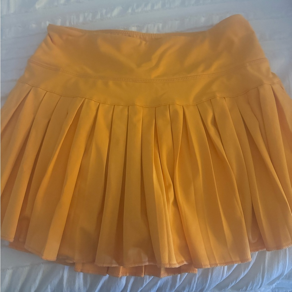 Orange gold hinge skirt